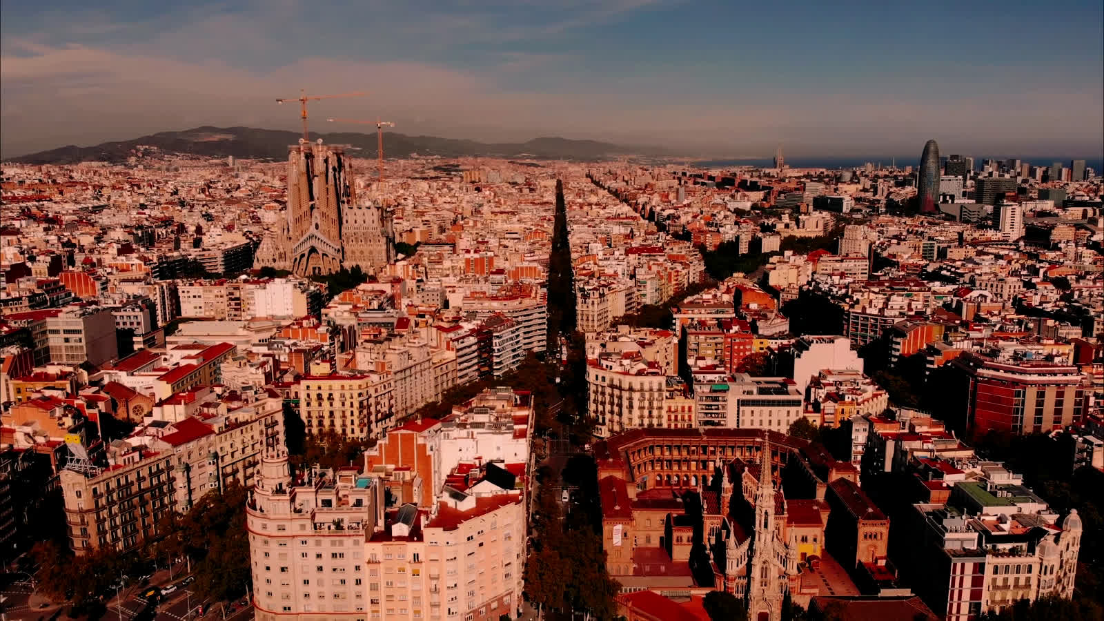 Aerial view of Barcelona — the Eixample grid and the Barceloneta beach